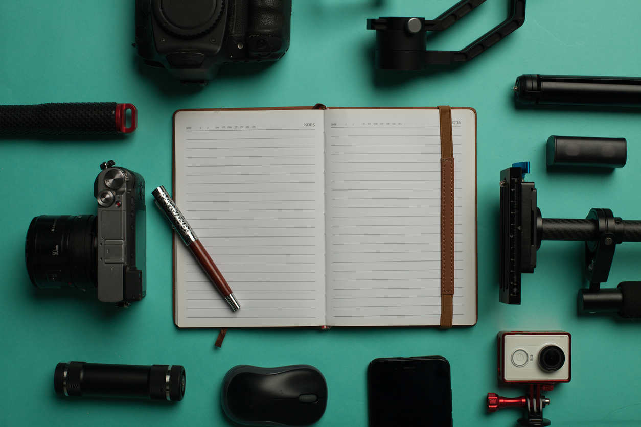 Camera, stabilizer, and recording equipment laid out for a live stream setup